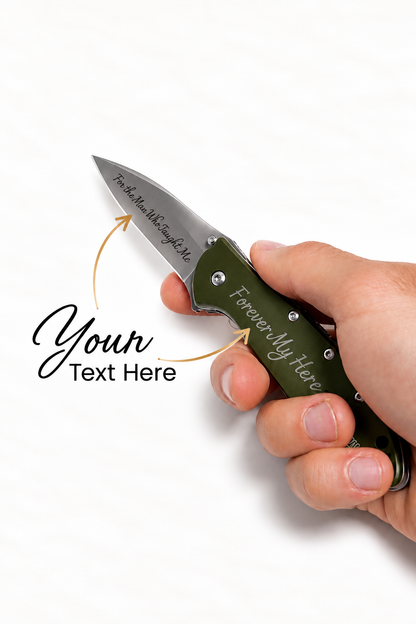 A hand holding a custom engraved folding pocket knife with an olive green handle and a silver blade, set against a plain white background. The image includes graphic callouts with placeholder text 'Your Text Here' pointing to the blade and handle engraving.