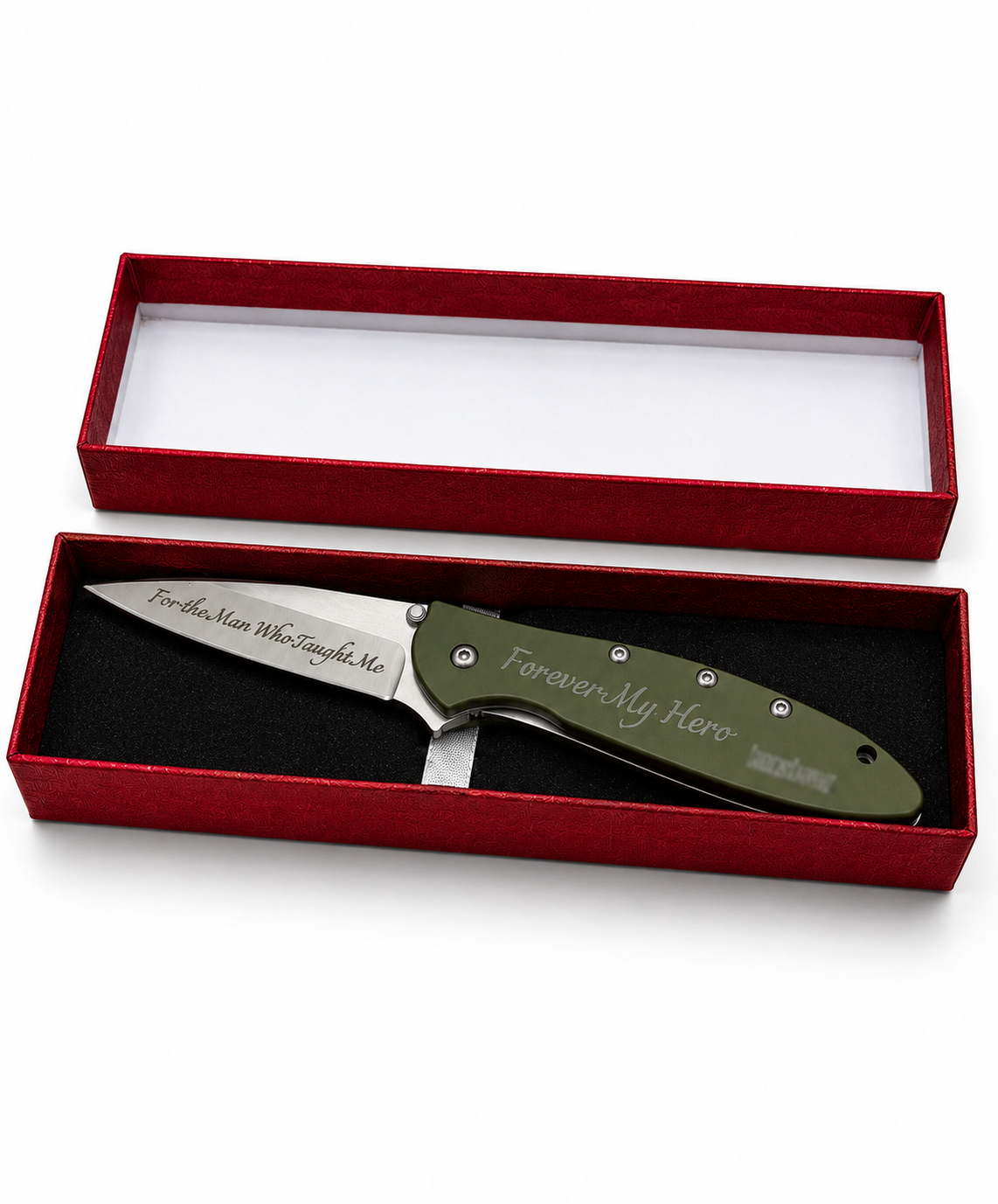 A personalized folding pocket knife with an olive green handle and a silver engraved blade, presented inside an open red velvet gift box with a black insert on a white background.