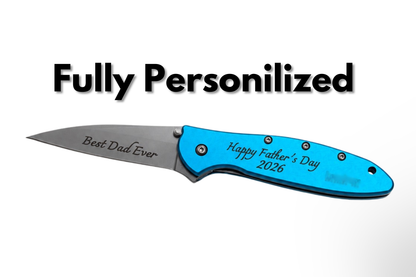 A custom pocket knife with a bright blue handle and a silver blade, featuring engraved text 'Best Dad Ever' on the blade and 'Happy Father's Day 2026' on the handle. The text 'Fully Personilized' is written in bold black letters above the knife on a white background.